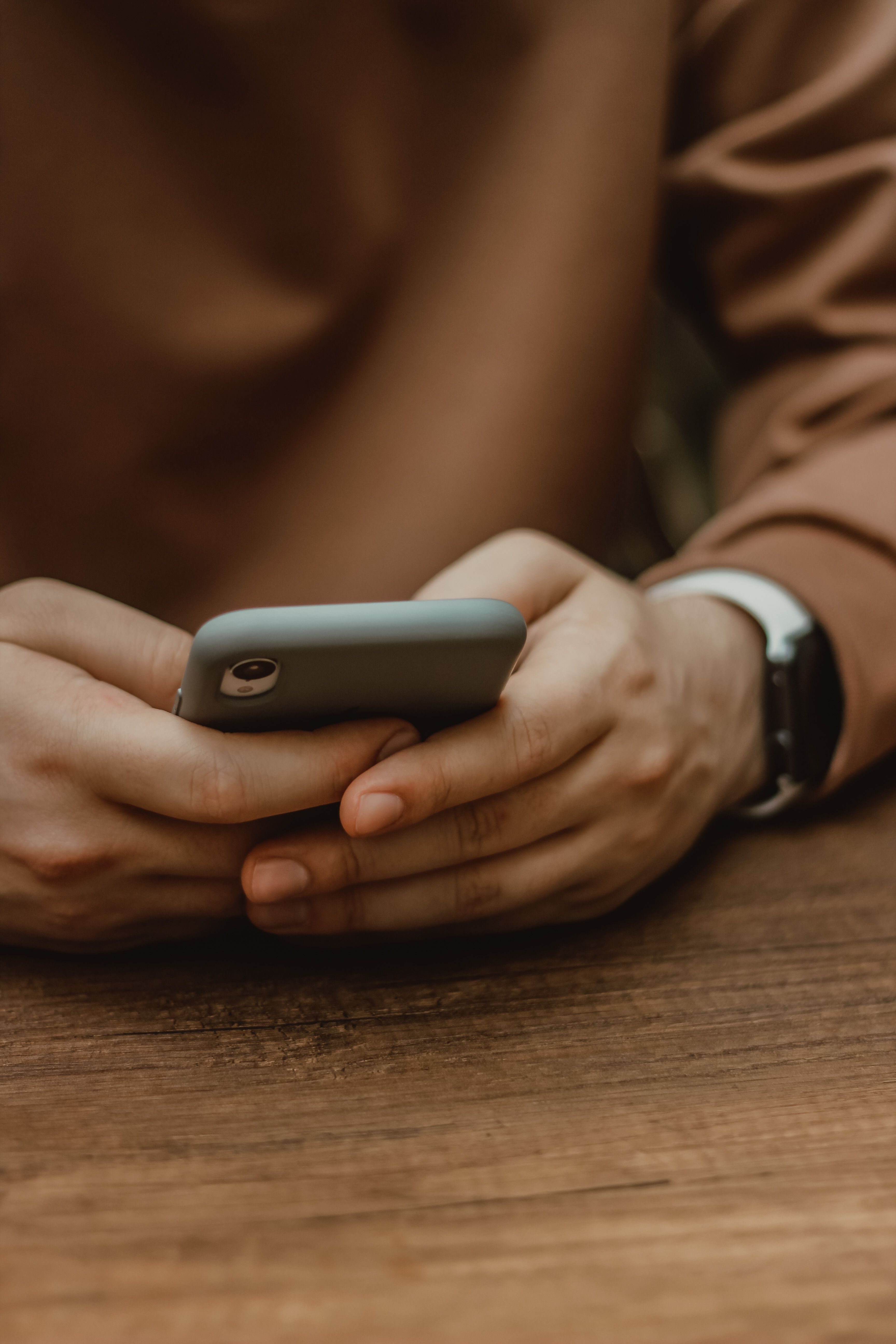 Hands holding phone